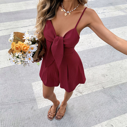 Resort-Style Solid-Colored Textured Jumpsuit With Bow Detail