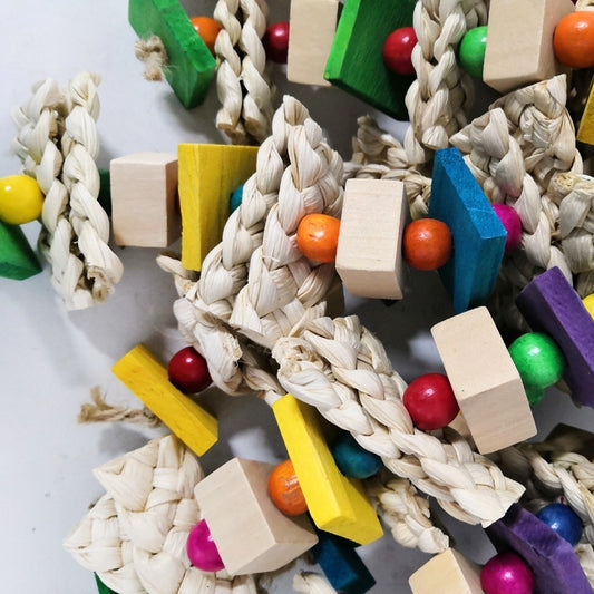 Parrots Gnaw On Toys Made Of Corn Husk And Wood